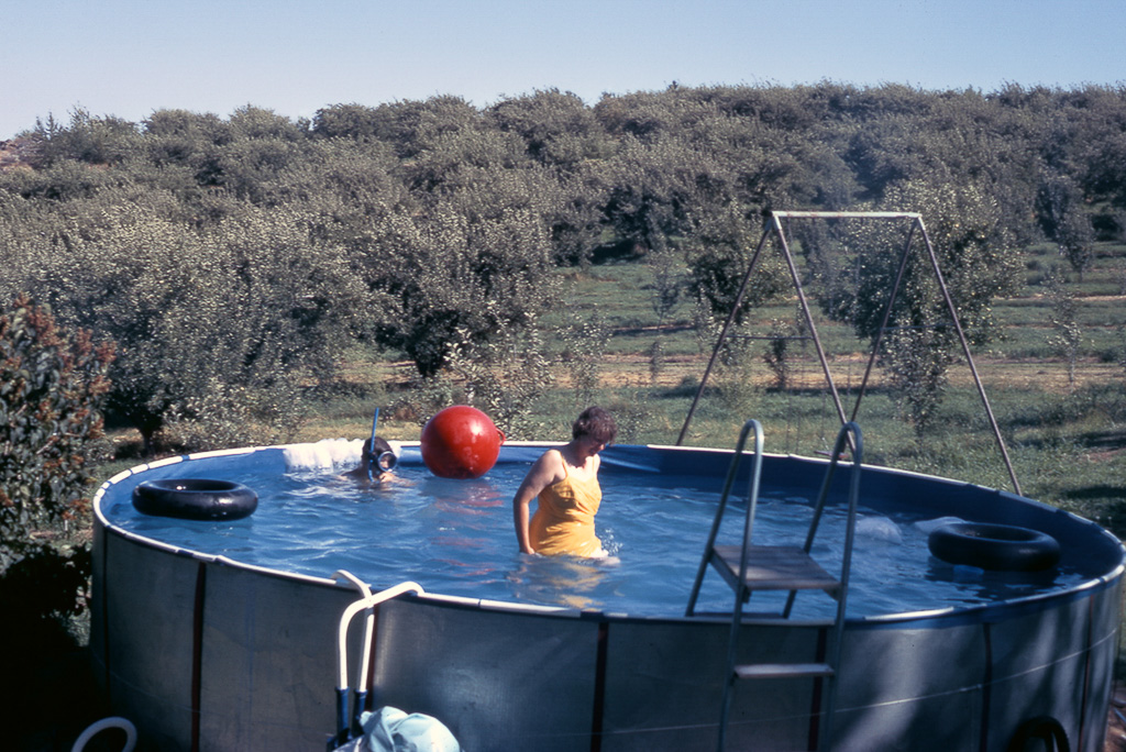 1971-08-00-Angie-tests-the-water-in-the-families-first-large-swimming-pool.jpg