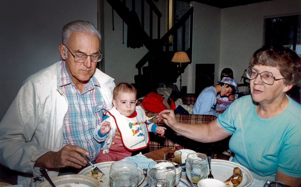 1987-05-00-Dan---Angie-with-Conrad,-Eric-Erin-in-the-background_r2026.jpg